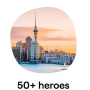 An image of the Auckland skyline featuring the Sky Tower with the waterfront and a sailboat in the foreground, set against a vibrant sunset An image of the Auckland skyline featuring the Sky Tower with the waterfront and a sailboat in the foreground, set against a vibrant sunset