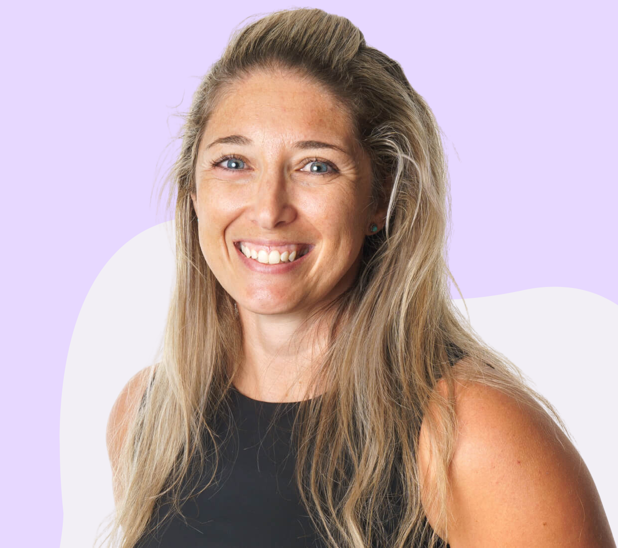 A blonde woman smiling.