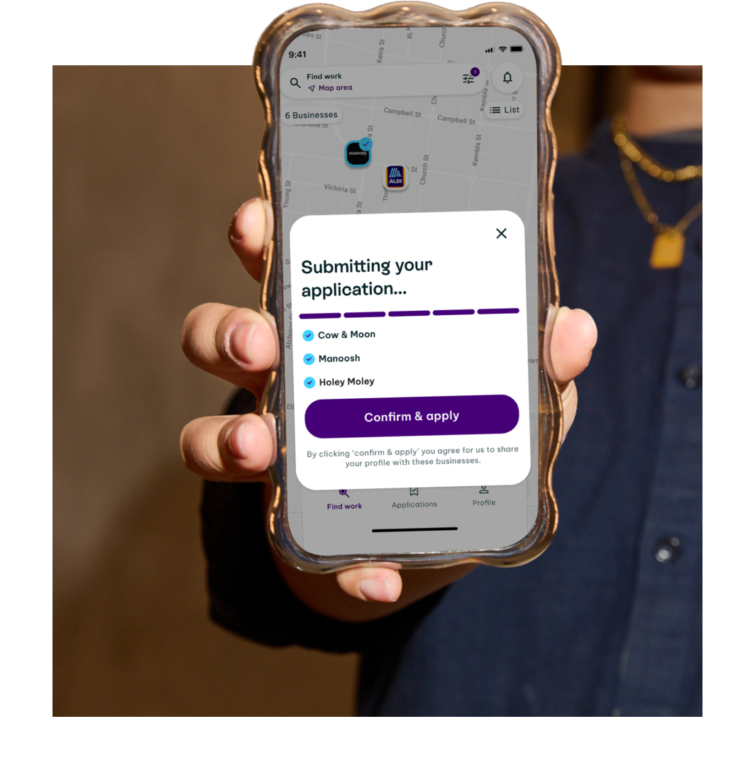 A phone showing a job application screen with a "Confirm & apply" button.
