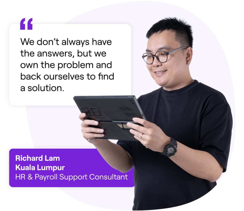 A smiling man wearing glasses and a black shirt while holding a tablet. Next to him is a quote that reads: 'We don’t always have the answers, but we own the problem and back ourselves to find a solution.' Text box below reads: 'Richard Lam, Kuala Lumpur, HR & Payroll Support Consultant'